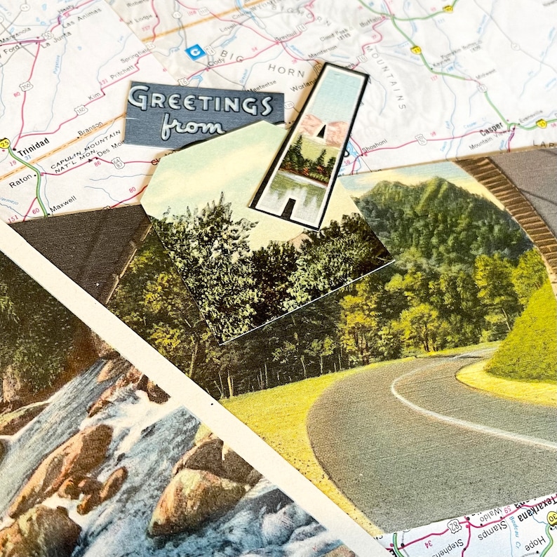 May include: A vintage postcard featuring a scenic road winding through a lush green forest. The postcard has a blue border and the text "Greetings from" printed on it.