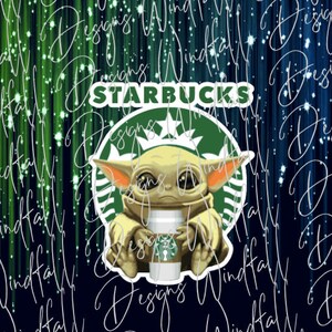 May include: A green Starbucks logo with a white star and a cartoon image of a green alien holding a cup of coffee. The text "STARBUCKS" is above the logo.