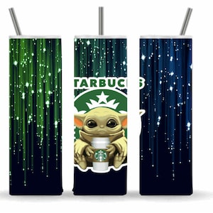 May include: A green and blue tumbler with a white straw and a graphic of a cartoon character holding a Starbucks cup. The character is green and has large ears. The background is a dark blue with green and white streaks.
