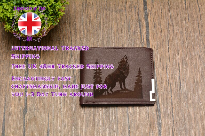 May include: A brown leather wallet with a laser engraved image of a wolf howling at the moon. The wolf is surrounded by trees and the wallet has a silver metal trim.
