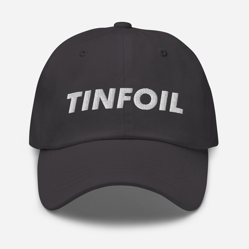 May include: A dark grey baseball cap with the word "TINFOIL" embroidered in white on the front.
