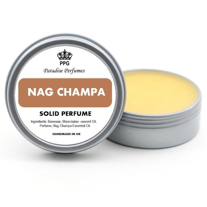May include: A silver tin with a brown label that reads "PPG Paradise Perfumes NAG CHAMPA SOLID PERFUME Ingredients: Beeswax, Shea butter, Almond Oil, Perfume, Nag Champa Essential Oil. HANDMADE IN UK"