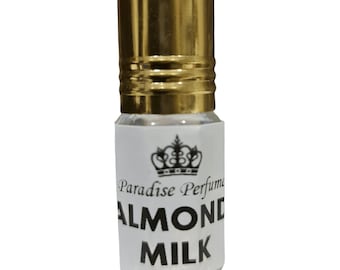May include: A small glass bottle with a gold cap and a white label. The label has a crown design and the text "Paradise Perfume ALMOND MILK".