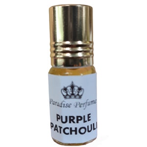 May include: A small glass bottle with a gold cap and a white label. The label has a crown design and the text "Paradise Perfume" and "PURPLE PATCHOULI".