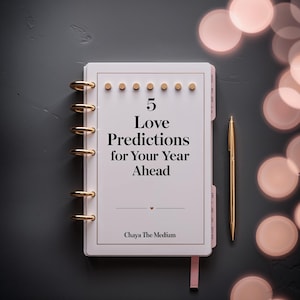 May include: A white disc-bound planner with gold rings and a gold pen. The cover features the text 5 Love Predictions for Your Year Ahead and Chaya The Medium, with a small heart icon. The design includes a row of six small gold circular accents.