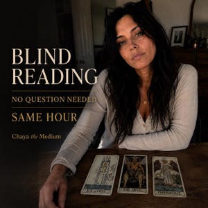 May include: A person with long dark hair wearing a light-colored long-sleeve shirt sits at a wooden table with three tarot cards: Ace of Cups, The Devil, and Temperance. Text reads: BLIND READING, NO QUESTION NEEDED, SAME HOUR, Chaya the Medium.