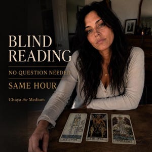 May include: A person with long dark hair wearing a beige long-sleeved shirt sits at a wooden table with three tarot cards: Ace of Cups, The Devil, and Temperance. Text reads: BLIND READING, NO QUESTION NEEDED, SAME HOUR, Chaya the Medium.