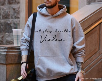 May include: A grey hoodie with the text "eat, sleep, breathe Violin" printed on the front.