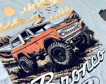 T-Shirt " FORD BRONCO". Color Blue and Rainbow Picture. Size: M. Unisex. Made from 100%Cotton. High Quality. New with Tag.