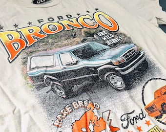 T-Shirt " FORD BRONCO" One Wild Horse! Color Light Brown and Rainbow Picture. Size: M. Unisex. Made from 100%Cotton. Unique and Quality. New