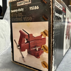 May include: A red Craftsman heavy-duty 4 1/2-inch swivel vise in its original box. The box is black with white text and has the model number 95186 printed on it.