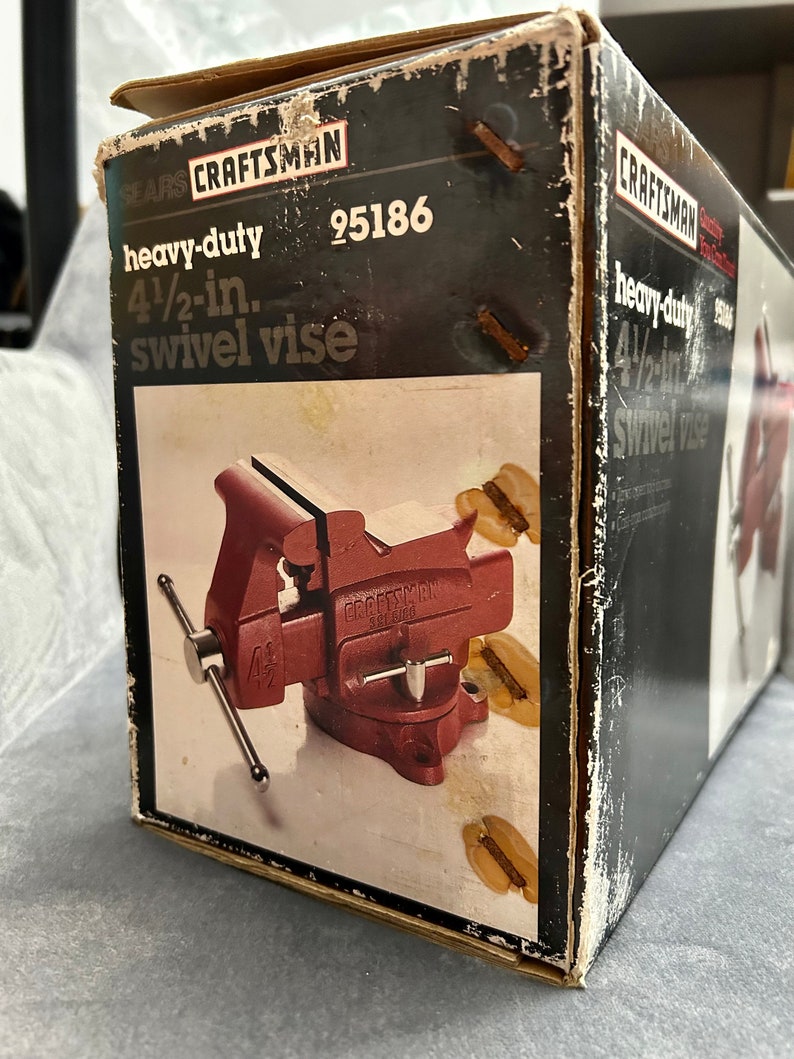 May include: A red Craftsman heavy-duty 4 1/2-inch swivel vise in its original box. The box is black with white text and has the model number 95186 printed on it.