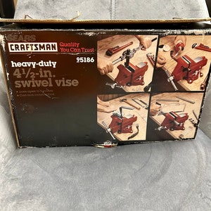May include: A red Sears Craftsman heavy-duty 4 1/2-inch swivel vise with cast-iron construction. The vise is shown in use in multiple applications, including holding a pipe wrench and a hammer.