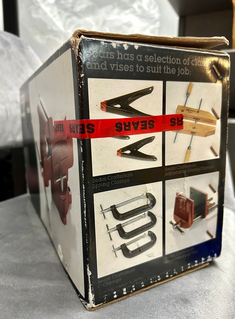 May include: A box of Sears Craftsman clamps, including spring clamps, C-clamps, and adjustable gluing clamps. The box is red, white, and black with the Sears logo.