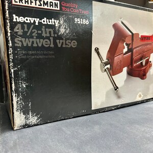 May include: A black and red box for a 4 1/2-inch heavy-duty swivel vise. The box has the Sears Craftsman logo and the text "Quality You Can Trust". The vise is made of cast iron and has a red finish. The box also includes the product number 95186.