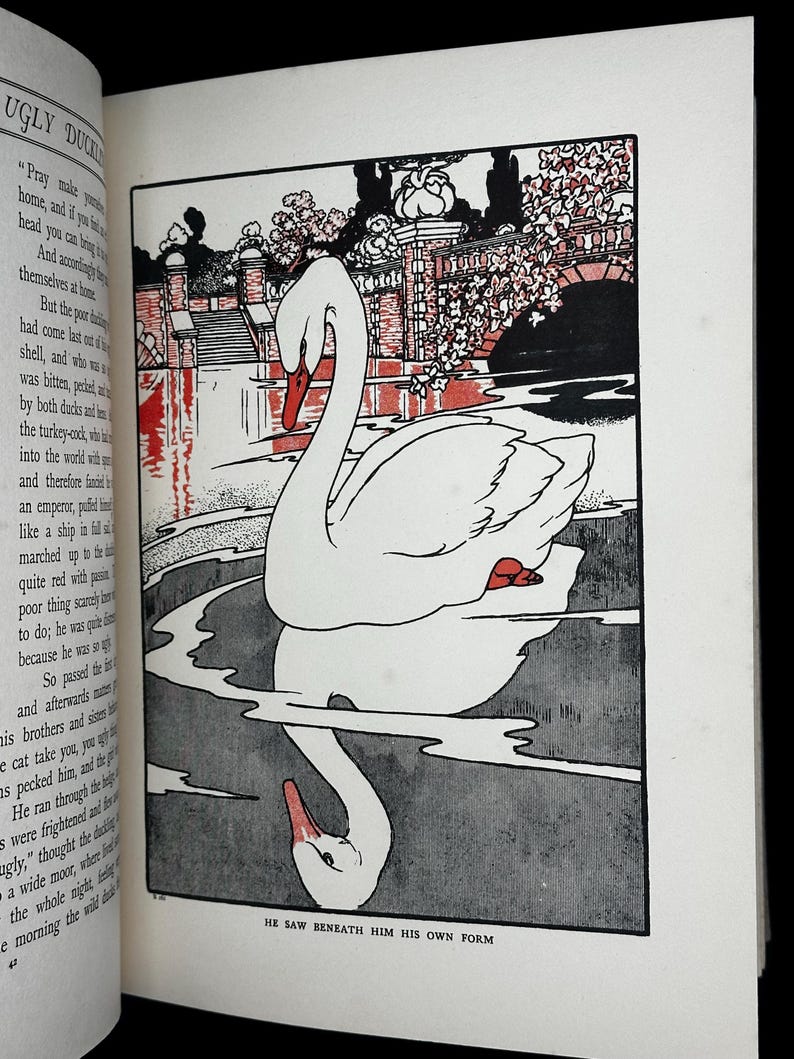 May include: Illustration from a children's book featuring a white swan with a red beak and feet, reflected in the water. The background includes a bridge and foliage, with the text "HE SAW BENEATH HIM HIS OWN FORM" at the bottom.