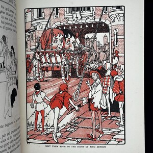 May include: A white ceramic mug with a black handle and the text "But First, Coffee" in a bold, black font. The mug is filled with a dark liquid, likely coffee, and sits on a light-colored surface.