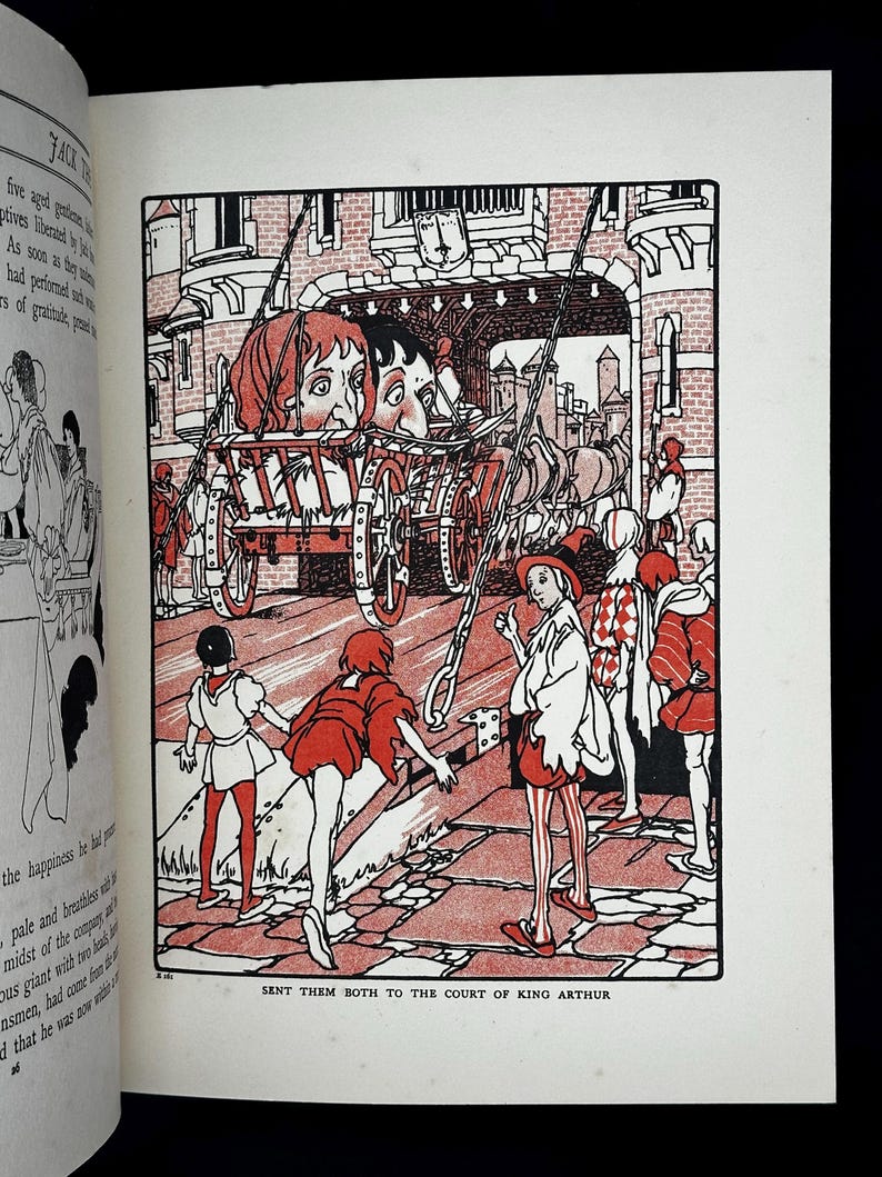 May include: A white ceramic mug with a black handle and the text "But First, Coffee" in a bold, black font. The mug is filled with a dark liquid, likely coffee, and sits on a light-colored surface.