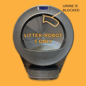 May include: A dark gray automatic litter box with a circular opening and a ribbed step at the base. Text on the unit reads LITTER-ROBOT 5 ONLY and URINE IS BLOCKED, with an orange outline pointing to the upper interior section of the device.