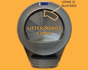 May include: A dark gray automatic litter box with a circular opening and a ribbed step at the base. Text on the unit reads LITTER-ROBOT 5 ONLY and URINE IS BLOCKED, with an orange outline pointing to the upper interior section of the device.