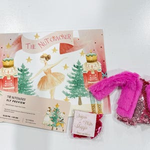 May include: A pink and white illustrated poster with the text "The Nutcracker" and a ticket for a Nutcracker Elf Preview event. The poster features a ballerina, two nutcracker soldiers, and a Christmas tree.