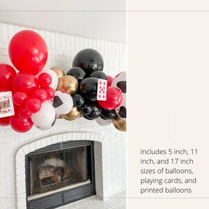 May include: A balloon garland with red, black, white, and gold balloons. The garland includes playing cards and printed balloons. The garland is decorated with 5 inch, 11 inch, and 17 inch balloons.