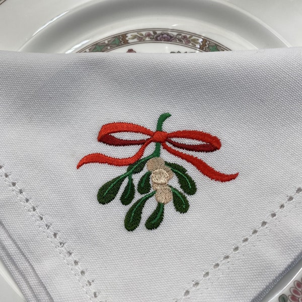 Festive Mistletoe Napkins Holiday Décor Christmas Parties Winter Gatherings Seasonal Celebrations cheerful table setting .