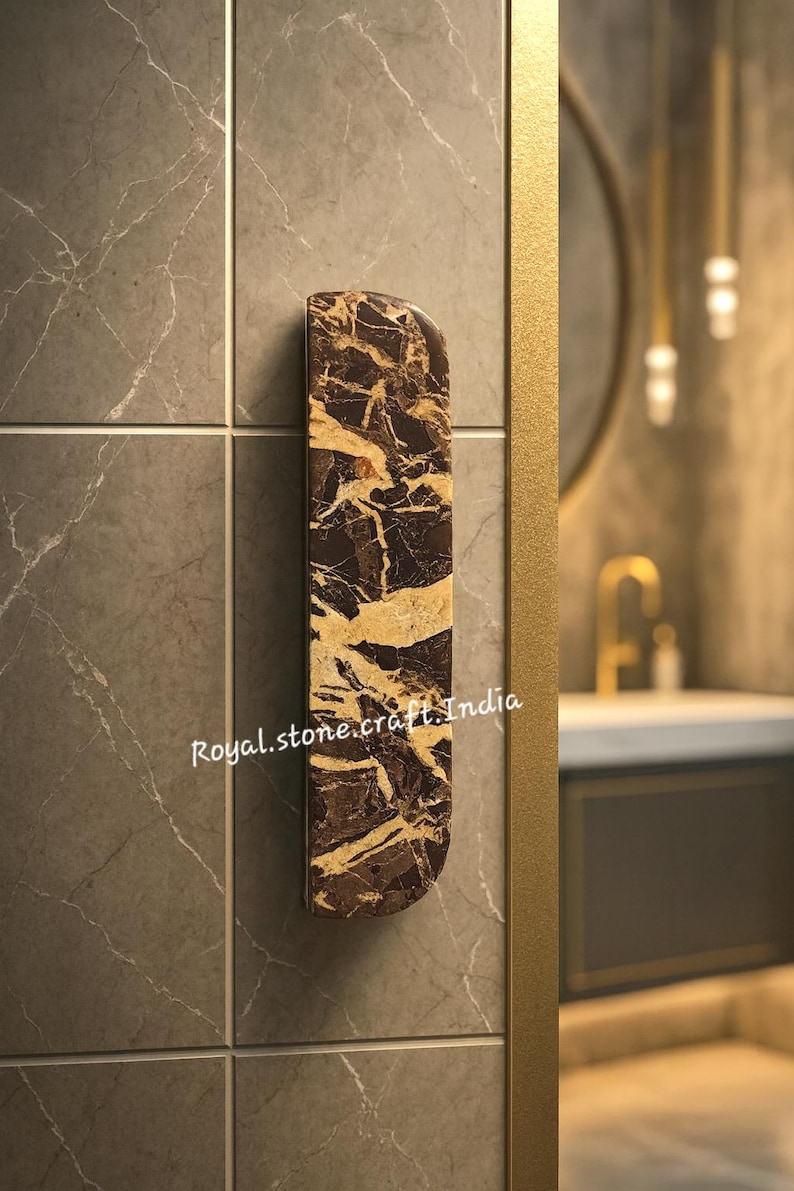 Luxury half moon marble wardrobe handle with natural brown and gold veining, premium stone cabinet pull installed on modern interior door