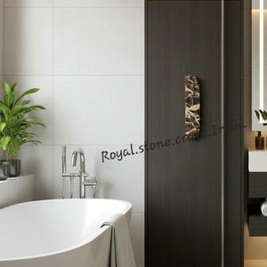 Luxury marble half moon handle installed on modern bathroom wardrobe, natural stone cabinet pull enhancing contemporary interior design