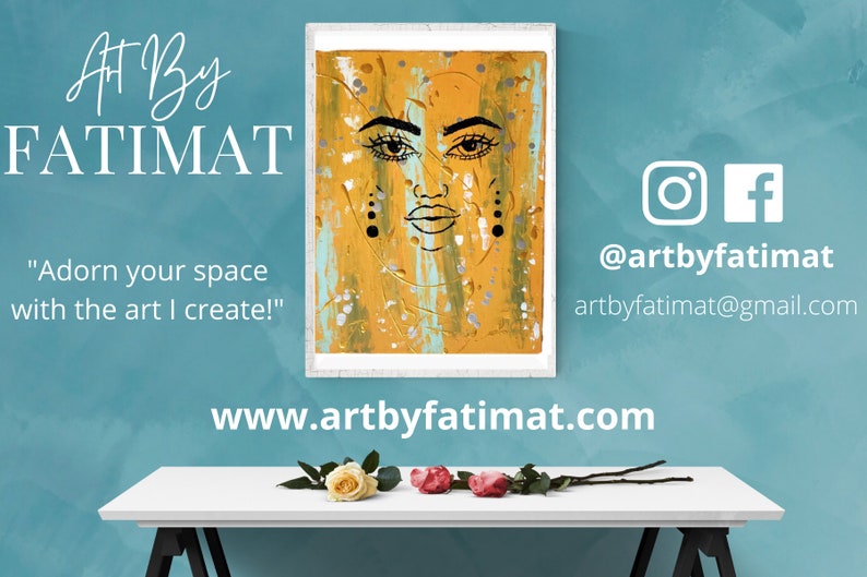 May include: A framed painting of a stylized face with black lines and yellow, blue, and silver paint splatters. The text "Art By FATIMAT" is above the painting and "Adorn your space with the art I create!" is below. The text "@artbyfatimat" and "artbyfatimat@gmail.com" are on the right side of the image. The text "www.artbyfatimat.com" is below the painting.