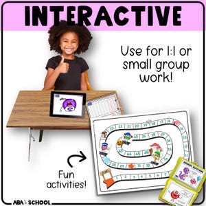 May include: An educational image with the word "INTERACTIVE" at the top. A young girl gives a thumbs up. A board game, tablet, and flashcards are on a wooden desk. The text says "Use for 1:1 or small group work!" and "Fun activities!"