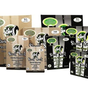 May include: A selection of Skunk Sack odour-free storage bags in different sizes, such as XL, Large, and Dual. The packaging displays a cartoon skunk logo and the words "Extreme Odour Protection". Bags are available in clear and black packaging.