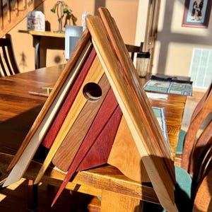 Beautiful unique hand made hardwood Birdhouse.