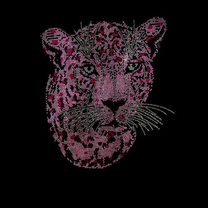 May include: A pink and white leopard head design created with small dots. The leopard's eyes are green.