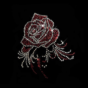 May include: A sparkling red and white rhinestone rose design on a black background. The rose is detailed with numerous rhinestones, creating a shimmering effect. The design is likely for apparel or accessories.