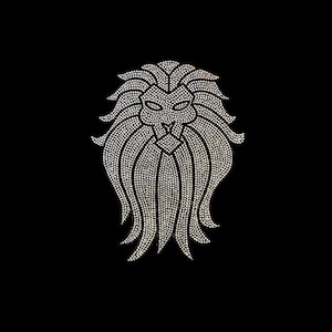 May include: A white rhinestone lion head design. The lion's mane is made of rhinestones and the face is outlined in rhinestones.