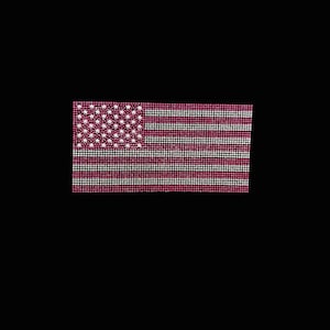 May include: A red, white, and blue American flag made of rhinestones. The flag is on a black background.