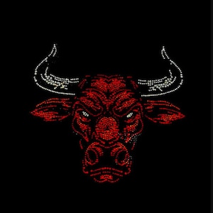 May include: A red bull's head with white horns, made of rhinestones, against a black background.