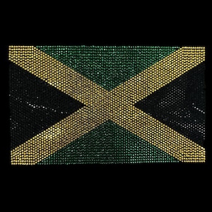 May include: A close-up of a Jamaican flag made of rhinestones. The flag is green, yellow, and black with a diagonal cross.