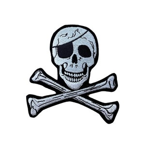 May include: A black and white embroidered patch of a skull and crossbones. The skull has a black eye patch over its left eye.