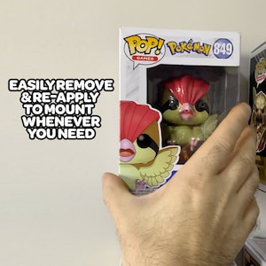 May include: A Funko Pop! Games vinyl figure of a green and red bird Pok&eacute;mon, with a white background and the text "Pop! Pok&eacute;mon 849 Games" on the box.