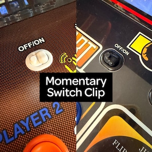May include: Close-up of two arcade game control panels. One panel features a white off/on switch and the text "OFF/ON". The other panel has a black off/on switch. The text "Momentary Switch Clip" is in a black box.