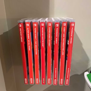 Slick, simple, slender. This Switch Game Shelf has it all – and mounts to your wall with included 3M Velcro Command Strips!