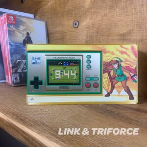 Proudly display your Game & Watch Zelda edition in your game room, garage or bedroom. Each shelf arrives with 3M Velcro Command Strips, instructions.