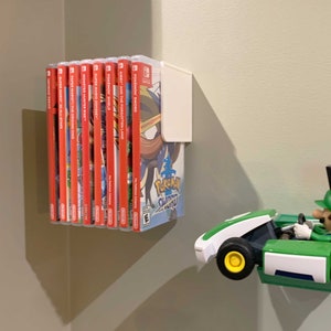 Slick, simple, slender. This Switch Game Shelf has it all – and mounts to your wall with included 3M Velcro Command Strips!