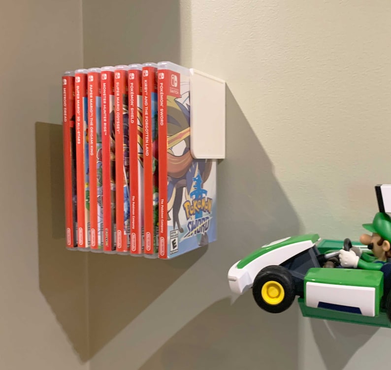 Slick, simple, slender. This Switch Game Shelf has it all – and mounts to your wall with included 3M Velcro Command Strips!