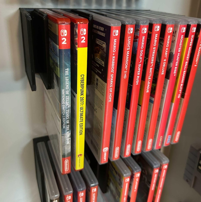 Flytande Nintendo Switch 1 & 2-spel med kommandoremsor | Väggmonterad organisation | FloatShelf bild 2