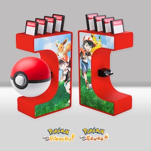 May include: Red and white Nintendo Switch game cartridge holder with a Poke Ball on the left side and a Pokemon Let's Go Pikachu! and Let's Go Eevee! logo on the bottom. The holder has a red and white design with a Pokemon Let's Go Pikachu! and Let's Go Eevee! theme.