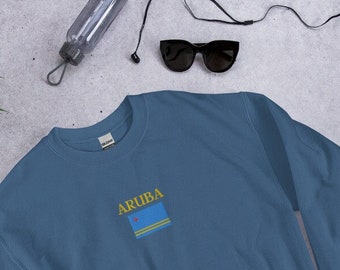 May include: A blue sweatshirt with the word "ARUBA" and the flag of Aruba embroidered on the front.