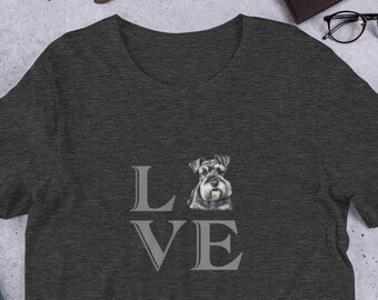 May include: A dark heather grey t-shirt with a graphic of a miniature schnauzer dog inside the word "LOVE".